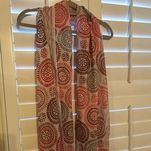 Beautiful scarf from Loft with deep shades of red and orange on cream background